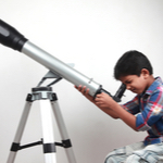 kid on microscope